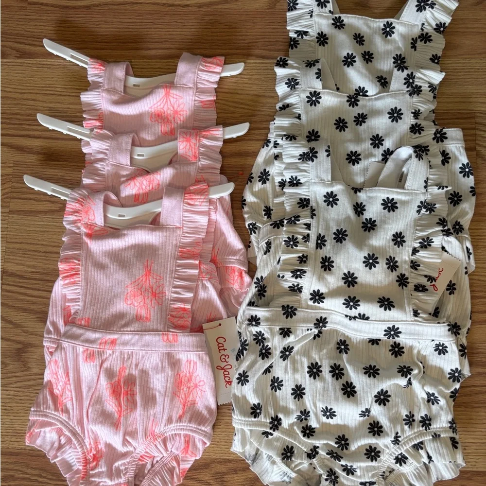 6 Cat & Jack…. 3 pink-(3 month old) 3 black and white-(12 month old)